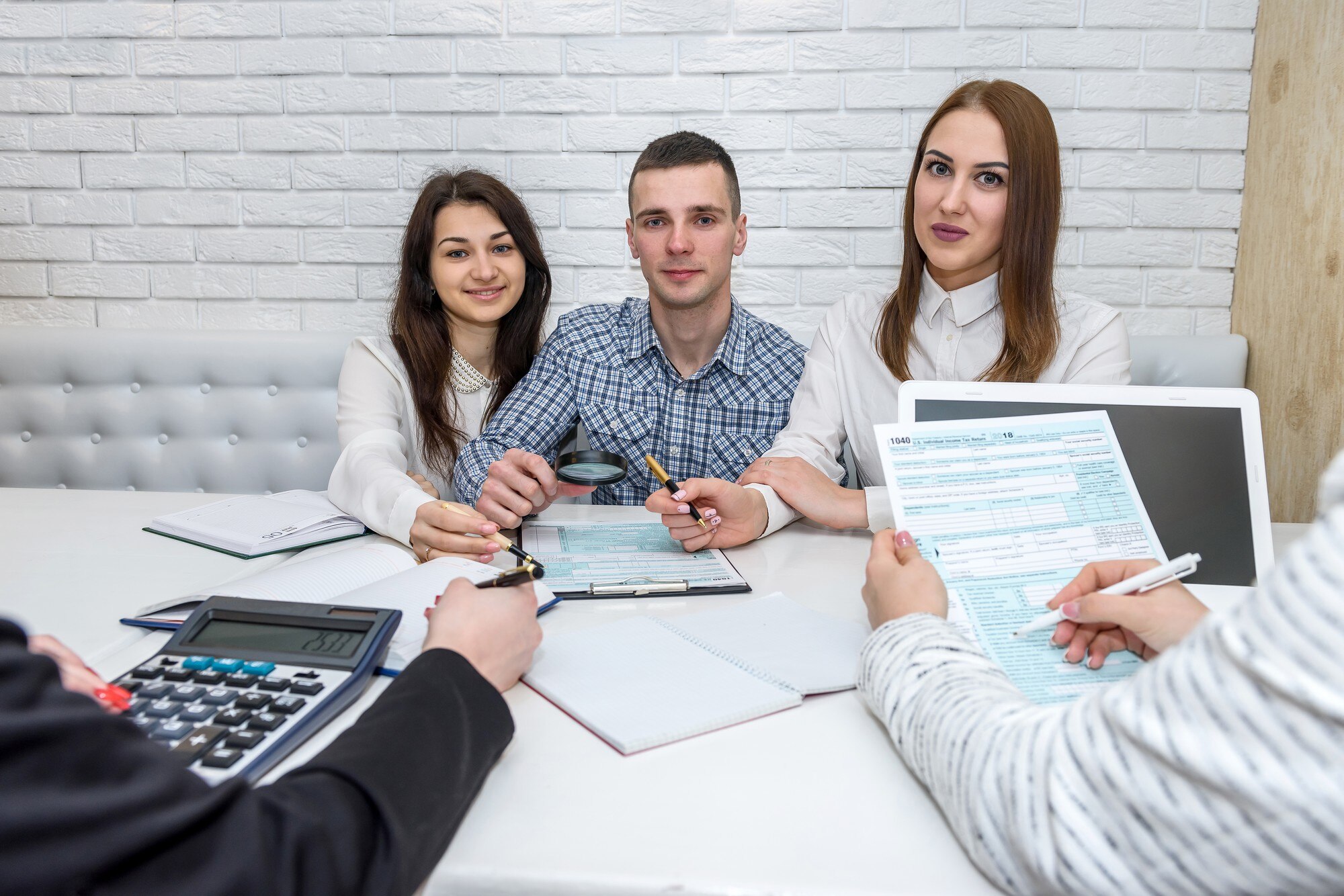 beautiful-financial-consultants-with-1040-tax-form-office-359031-13825.jpg